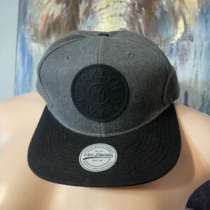 H&M "BRKLY NW YRK" snapback cap in dark grey marl and black adjustable New York